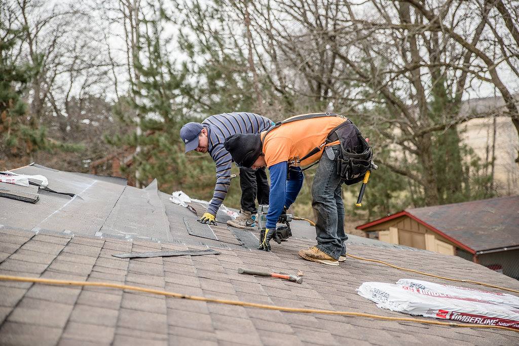 northface workers fixing roof after storm damage