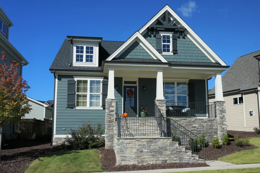 Small blue house with white trim in Maple Grove