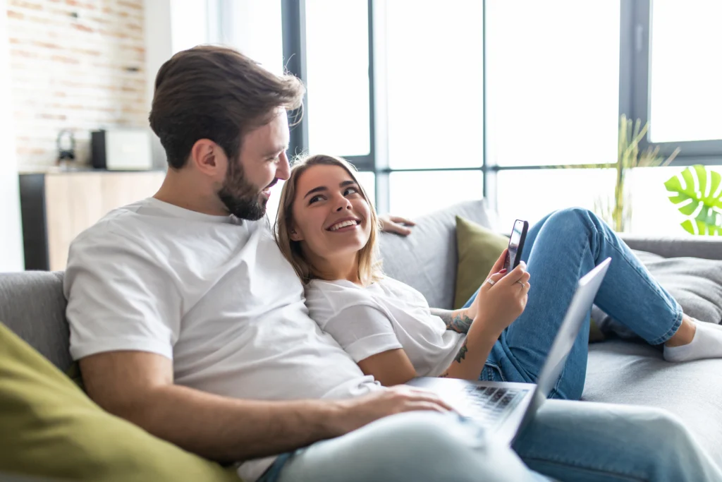 A couple sits peacefully inside their new home.