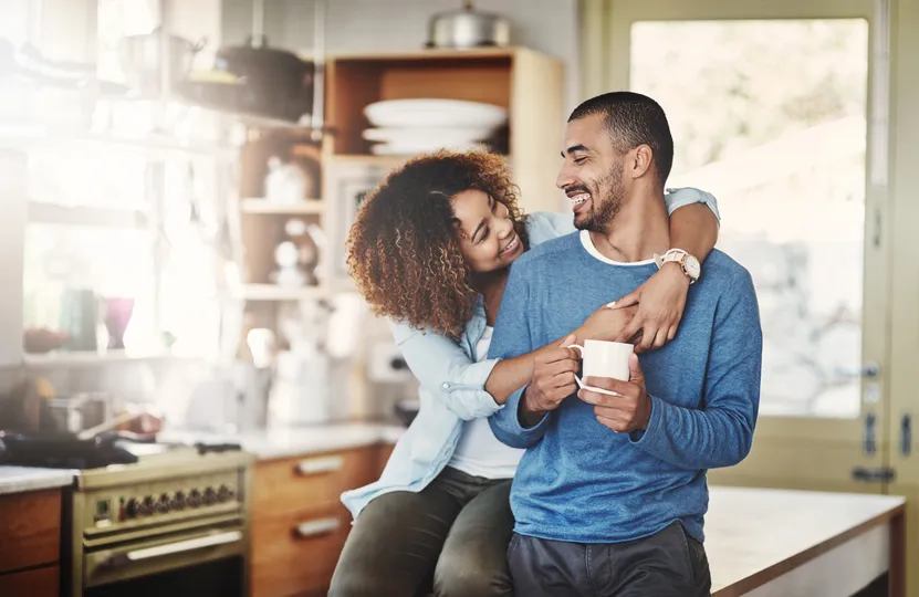 Couple hugging each other in their Minnetonka home