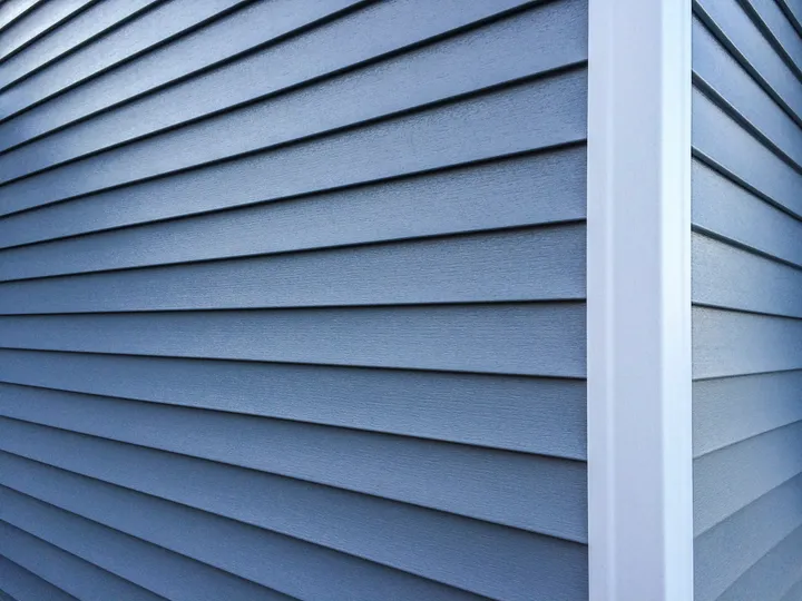 Dark blue LP Smartside siding on a new house in Coon Rapids
