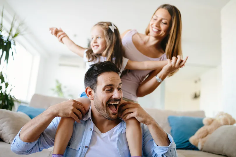 Family playing together in their Forest Lake house