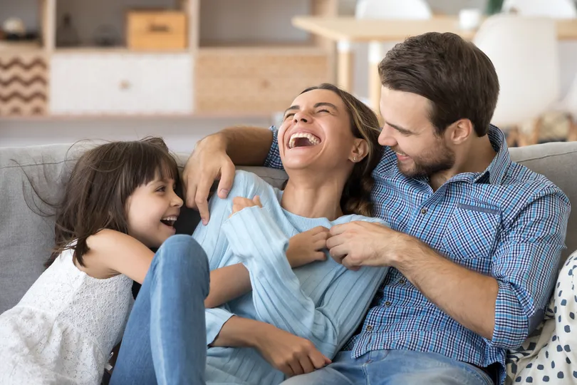 Happy homeowners in Lino Lakes sitting together