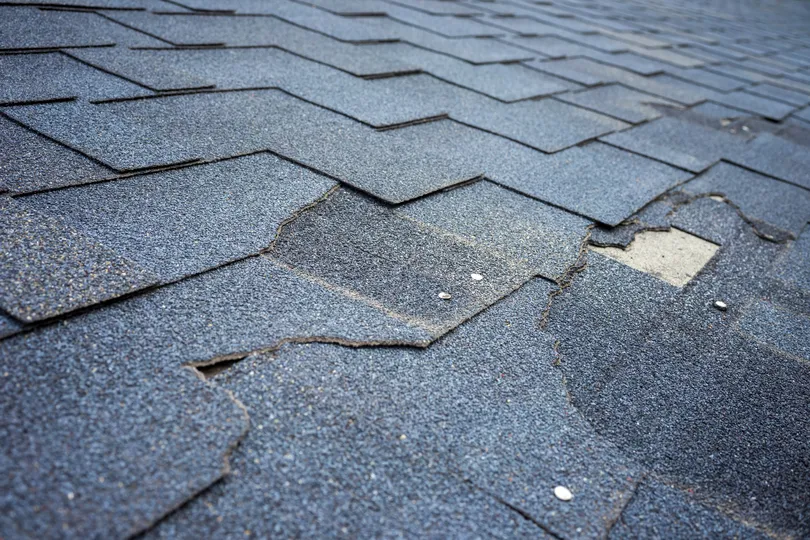 Signs of storm damage on a roof in Elk River 