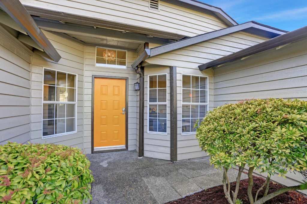 front porch with yellow door