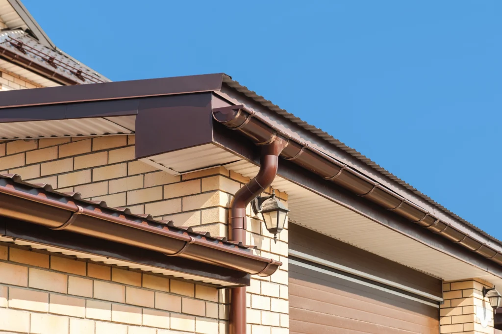 Gutters on a tan brick house