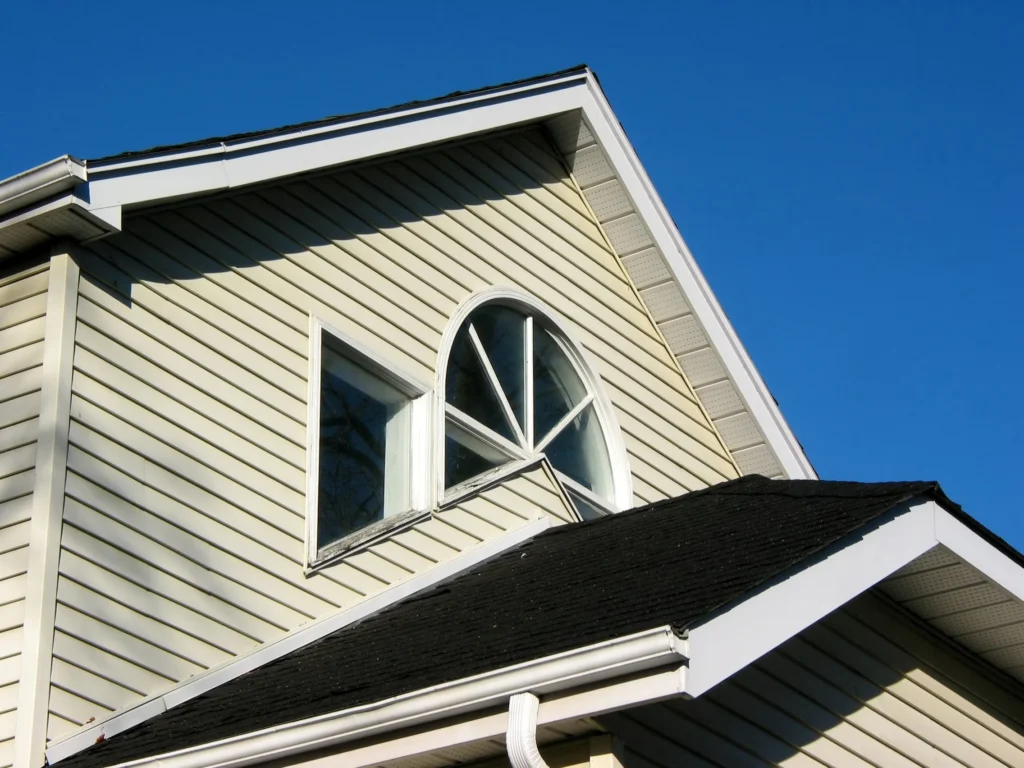cream colored siding against a blue sky in lino lakes mn