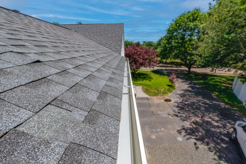 aerial view of gutters on house with grey shingles roof