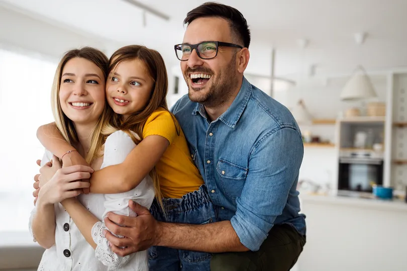 Happy homeowners together in their home in Wayzata