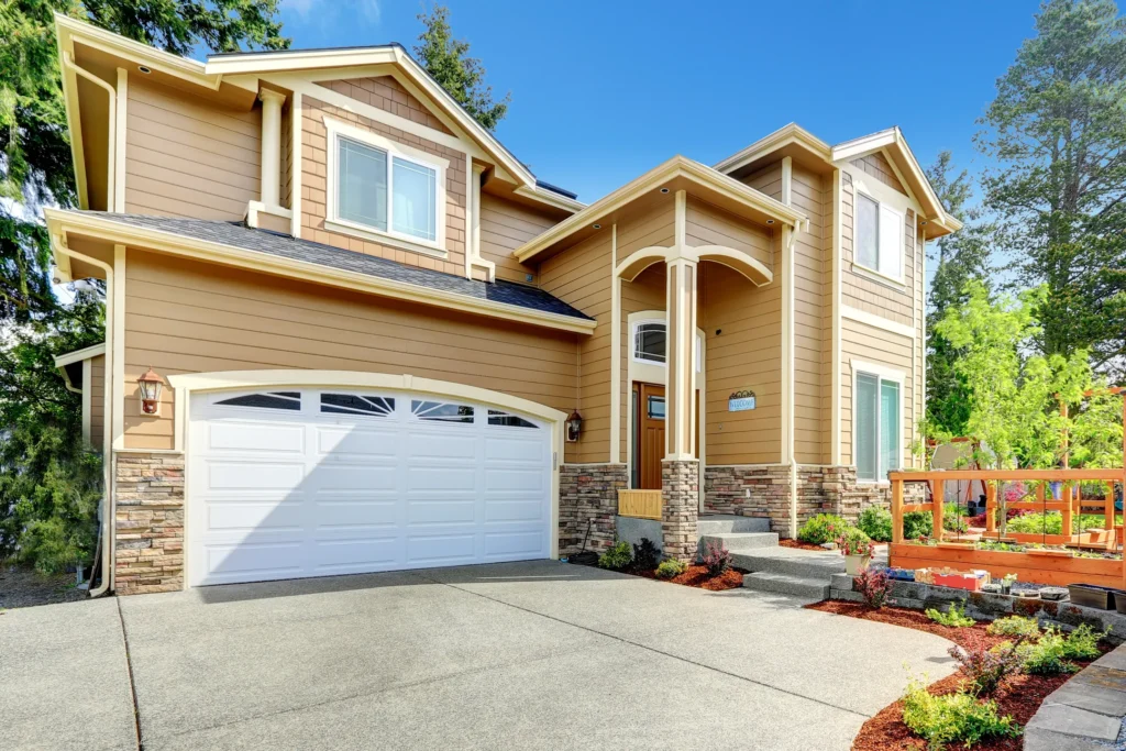 Lino Lakes yellow home with a white garage