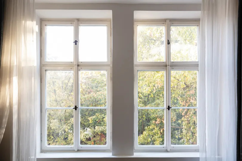 New windows with white curtains in a Edina home