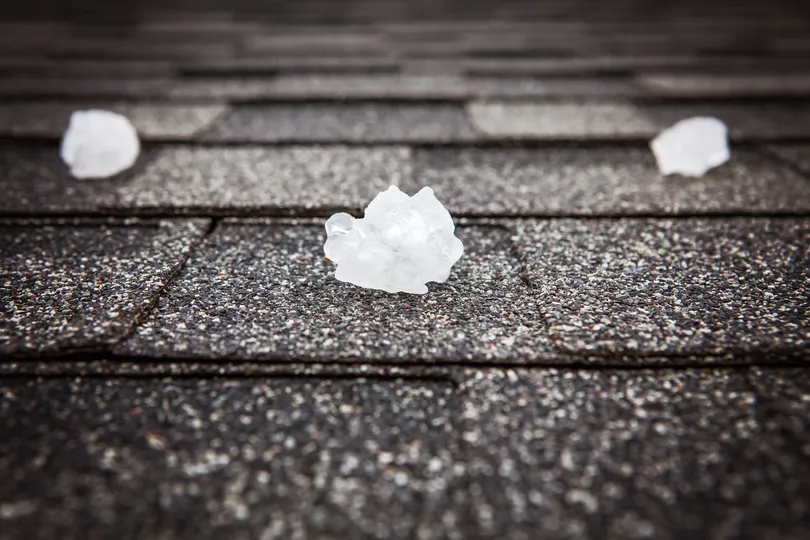 Roof hail damage on a house in Milaca