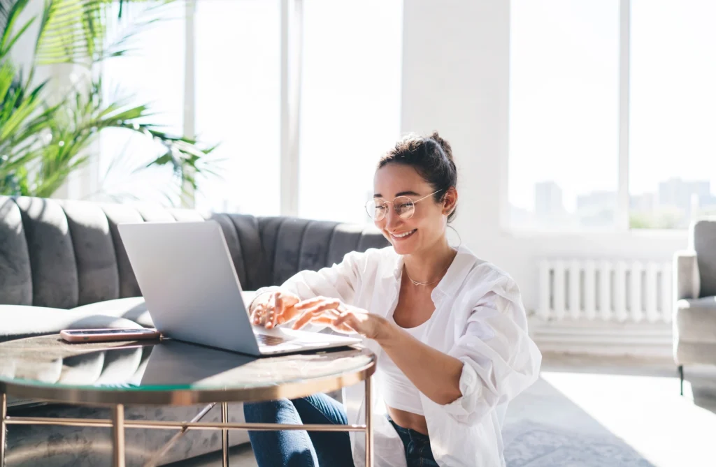 excelsior homeowner on computer in living room