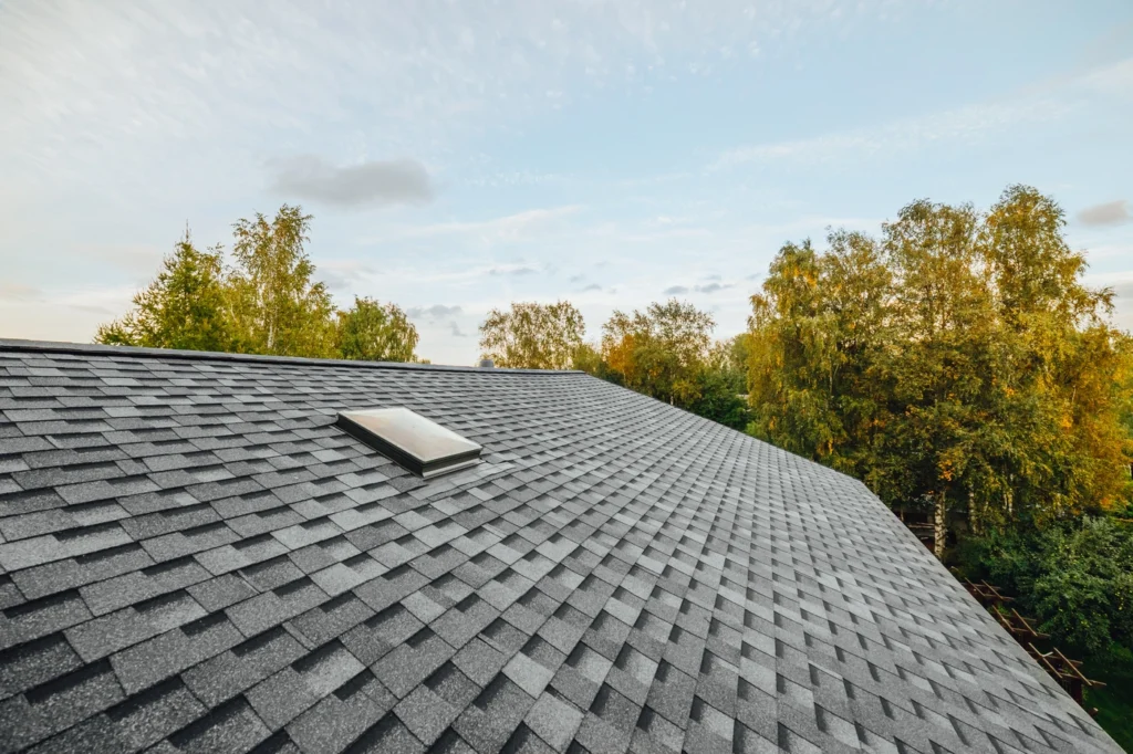 Close up view of roof with architectural shingles after storm damage roof repair