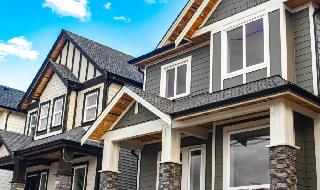 grey siding installation on large minnesota home
