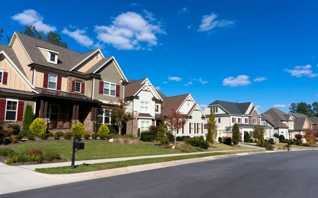 street view of neighborhood with new siding installation on several homes