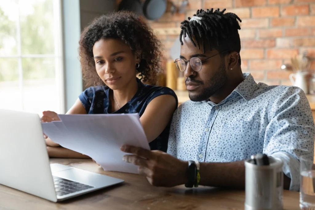 young couple looking at documents