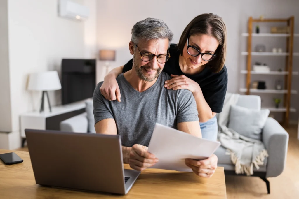 couple at home looking at documents