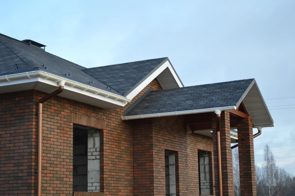 brick house with new gutters
