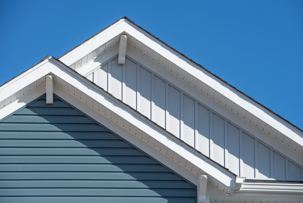 Double gable roof white and blue siding