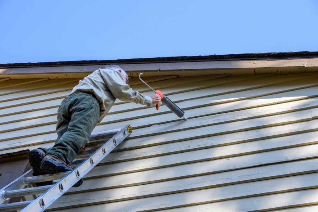 Sealing siding on house