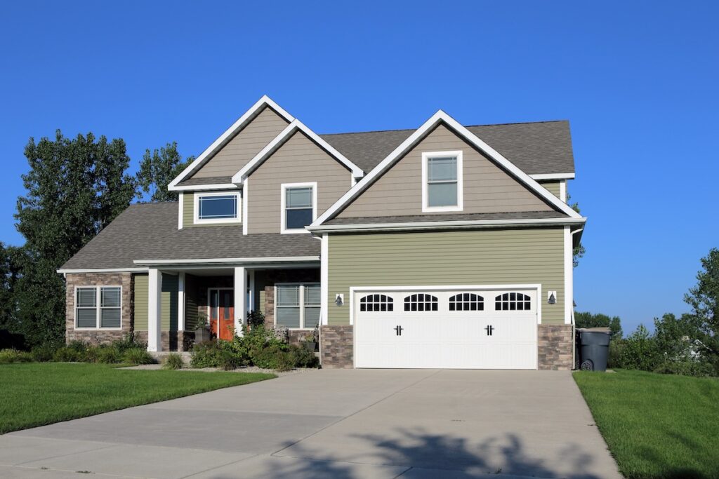 Modern family home with green and tan siding