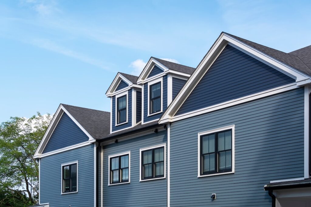 Two toned blue siding on large house
