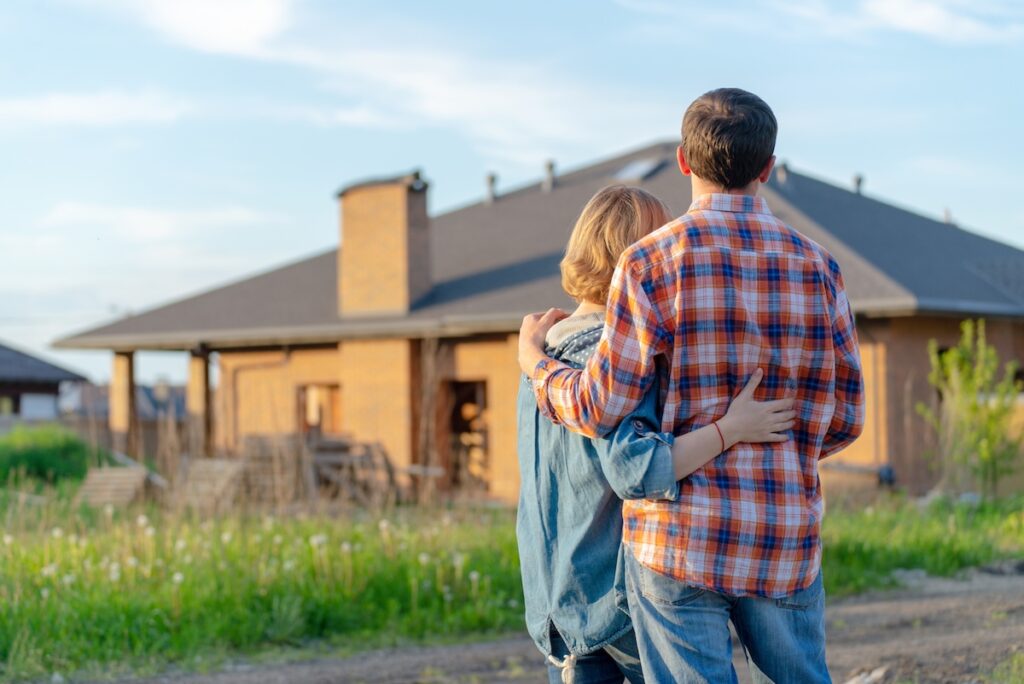 loving couple looking at their home