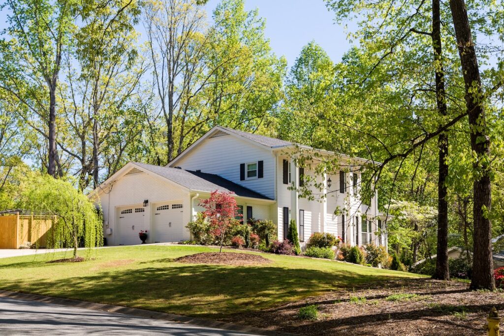 White Siding with Columns on hill