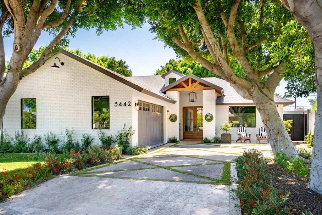 white brick house with large windows
